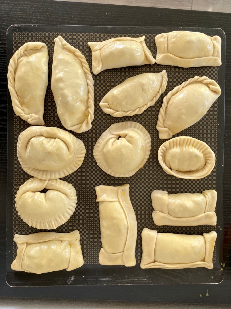 Making empanadas de pino (empanadas with beef filling)