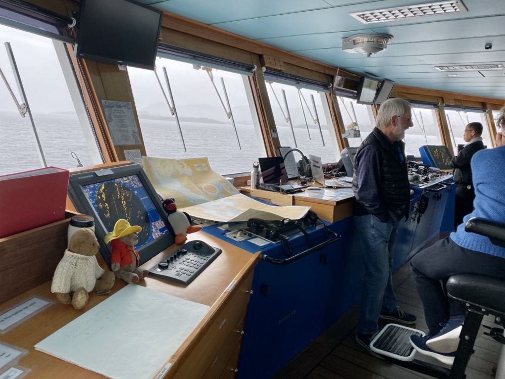 The dudes by the ship's navigation equipment